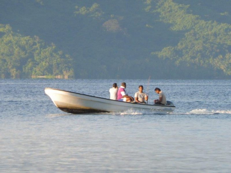 Fishing courses on Savusavu Bay Four men in a boat travelling over Savusavu Bay.