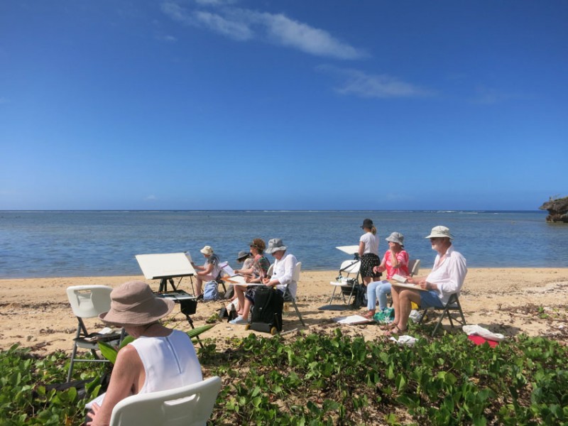 Students painting in nature Fiji art course