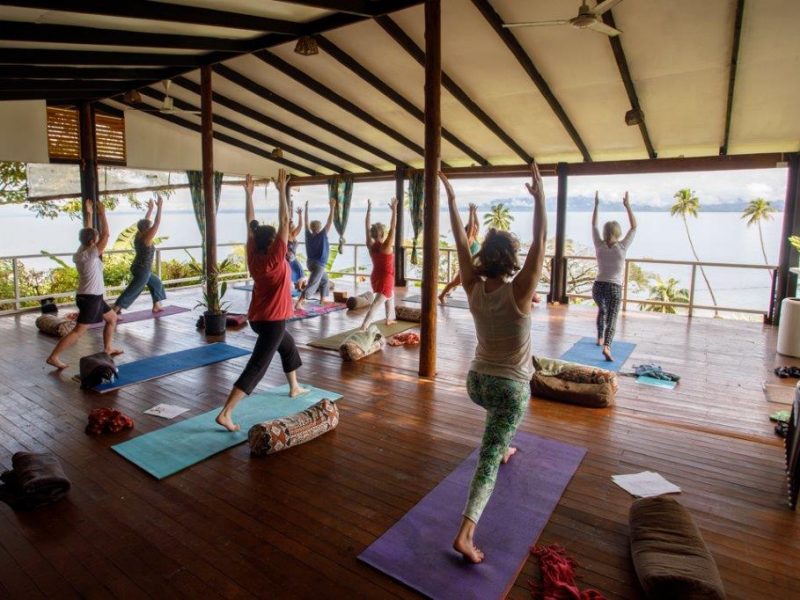 Brett Monroe Garner leads yoga on the deck at Daku Resort, Savusavu.